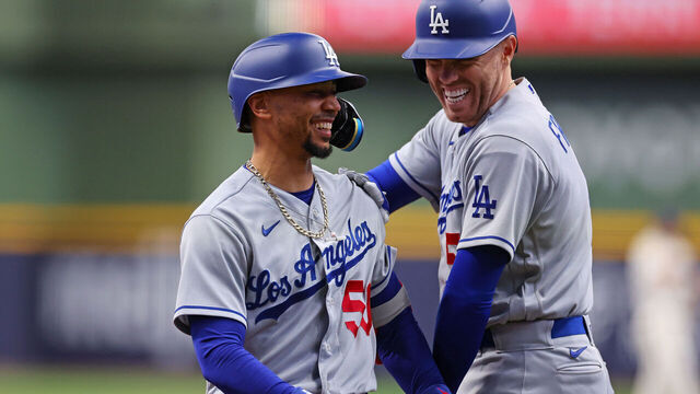 MILWAUKEE, WISCONSIN - MAY 09: Mookie Betts #50 of the Los Angeles Dodgers is congratulated by Freddie Freeman #5 following a home run against the Milwaukee Brewers during the first inning at American Family Field on May 09, 2023 in Milwaukee, Wisconsin.