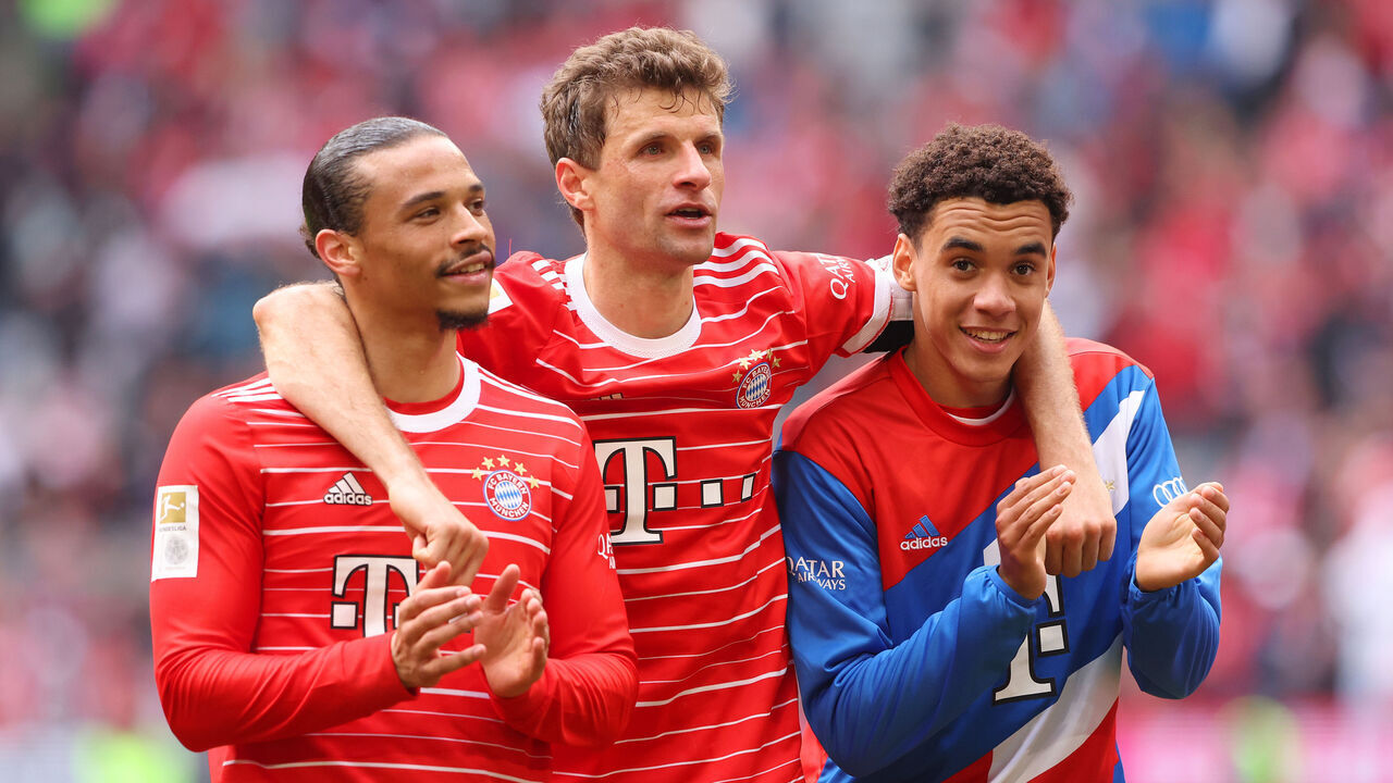MUNICH, GERMANY - MAY 13: Leroy Sane, Thomas Mueller and Jamal Musiala of FC Bayern Munich celebrate following the team's victory during the Bundesliga match between FC Bayern München and FC Schalke 04 at Allianz Arena on May 13, 2023 in Munich, Germany.