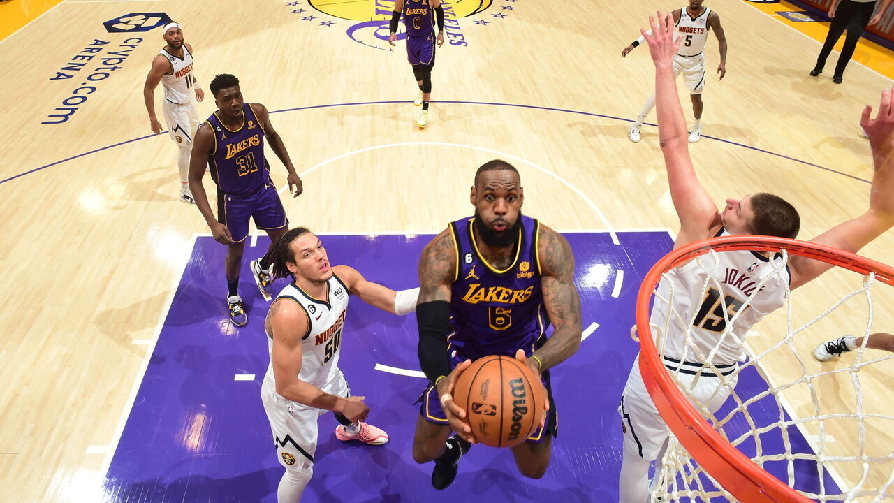 LOS ANGELES, CA - DECEMBER 16: LeBron James #6 of the Los Angeles Lakers drives to the basket during the game against the Denver Nuggets on December 16, 2022 at Crypto.Com Arena in Los Angeles, California. NOTE TO USER: User expressly acknowledges and agrees that, by downloading and/or using this Photograph, user is consenting to the terms and conditions of the Getty Images License Agreement. Mandatory Copyright Notice: Copyright 2022 NBAE