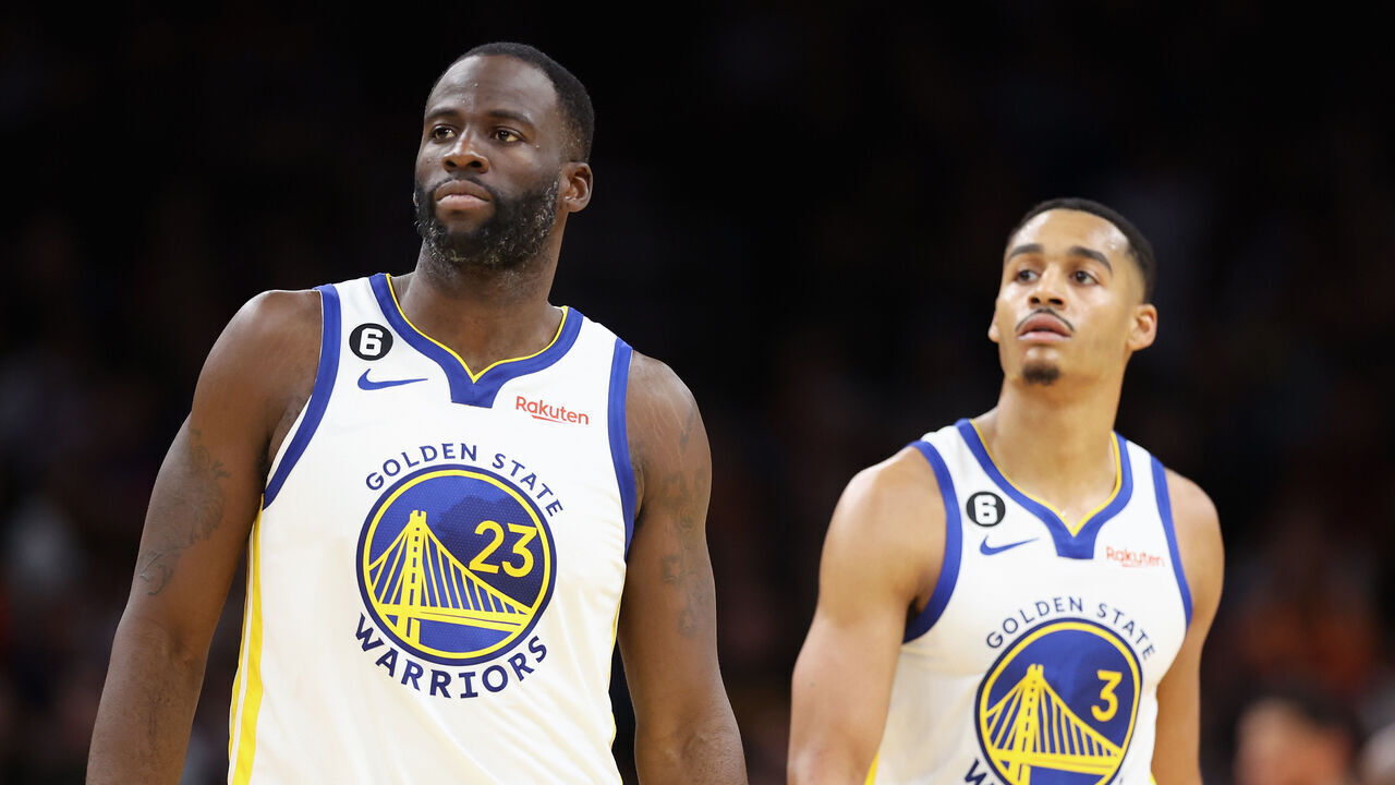 PHOENIX, ARIZONA - OCTOBER 25: (L-R) Draymond Green #23 and Jordan Poole #3 of the Golden State Warriors walk to the bench during the second half of the NBA game against the Phoenix Suns at Footprint Center on October 25, 2022 in Phoenix, Arizona. The Suns defeated the Warriors 134-105.