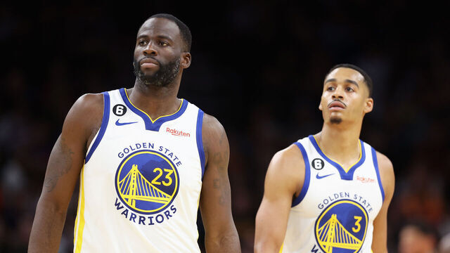 PHOENIX, ARIZONA - OCTOBER 25: (L-R) Draymond Green #23 and Jordan Poole #3 of the Golden State Warriors walk to the bench during the second half of the NBA game against the Phoenix Suns at Footprint Center on October 25, 2022 in Phoenix, Arizona. The Suns defeated the Warriors 134-105.