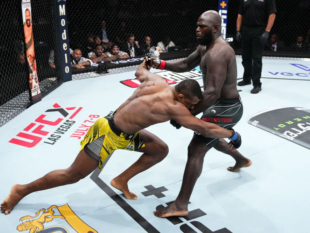 CHARLOTTE, NORTH CAROLINA - MAY 13: (L-R) Jailton Almeida of Brazil attempts to take down Jairzinho Rozenstruik of Suriname in their heavyweight fight during the UFC Fight Night event at Spectrum Center on May 13, 2023 in Charlotte, North Carolina.