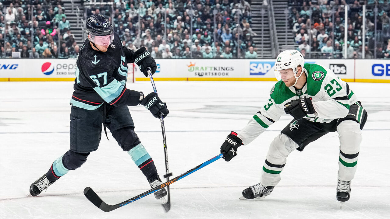 SEATTLE, WASHINGTON - MAY 7:Morgan Geekie #67 of the Seattle Kraken attempts a shot as Esa Lindell #23 of the Dallas Stars blocks his stick during the first period in Game Three of the Second Round of the 2023 Stanley Cup Playoffs at Climate Pledge Arena on May 7, 2023 in Seattle, Washington.