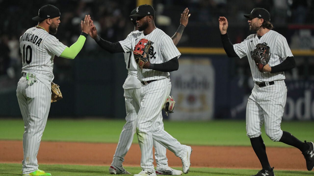 CHICAGO, IL - MAY 13: Chicago White Sox third baseman Yoan Moncada (10) greets Chicago White Sox center fielder Luis Robert Jr. (88) after a Major League Baseball game between the Houston Astros and the Chicago White Sox on May 13, 2023 at Guaranteed Rate Field in Chicago, IL.