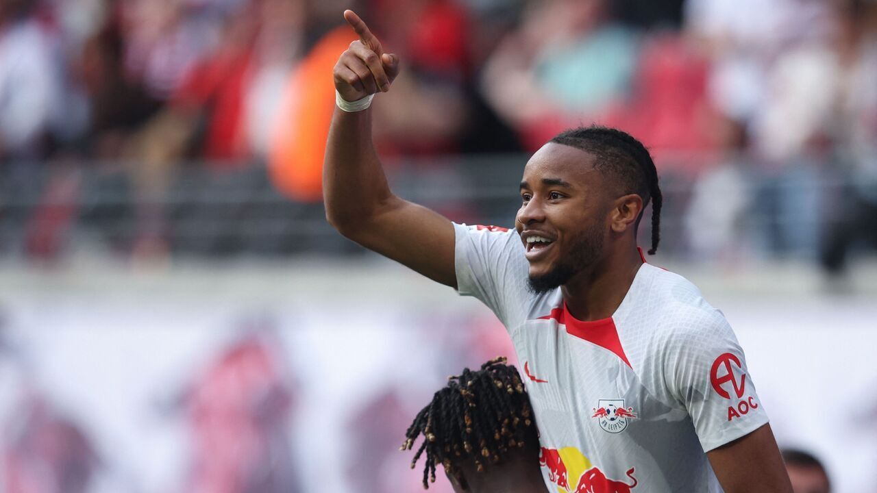 Leipzig's French forward Christopher Nkunku (R) and Leipzig's Malian midfielder Amadou Haidara celebrates scoring the 2-1 goal during the German first division Bundesliga football match between RB Leipzig and Werder Bremen in Leipzig on May 14, 2023.