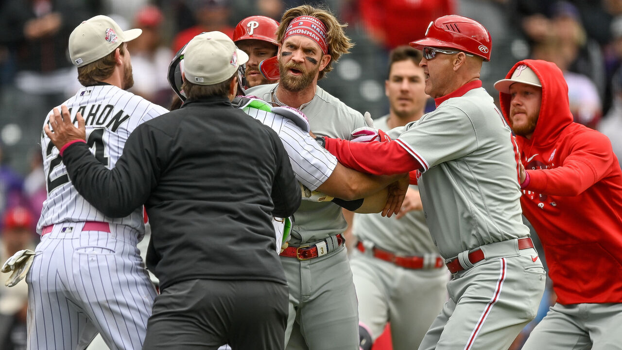 DENVER, CO - MAY 14: Bryce Harper #3 of the Philadelphia Phillies runs on the field as the benches clear in the seventh inning of a game at Coors Field on May 14, 2023 in Denver, Colorado.