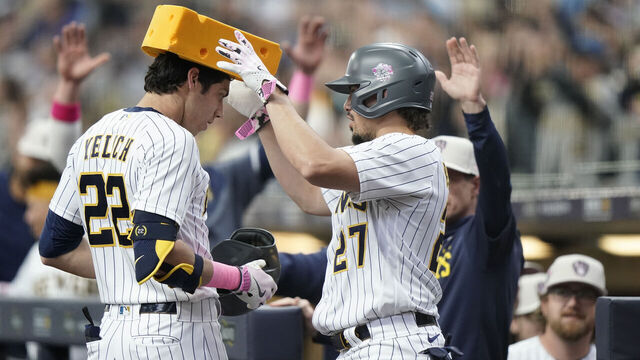 MILWAUKEE, WI - MAY 14: Christian Yelich #22 of the Milwaukee Brewers celebrates with teammate Willy Adames #27 after hitting a home run during the first inning of the game between the Kansas City Royals and the Milwaukee Brewers at American Family Field on Sunday, May 14, 2023 in Milwaukee, Wisconsin.