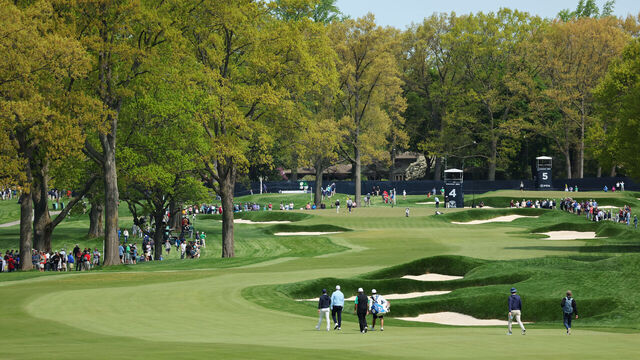 ROCHESTER, NEW YORK - MAY 15: A general view of the fourth hole as Rory McIlroy of Northern Ireland, Shane Lowry of Ireland and Luke Donald of England walk the fairway during a practice round prior to the 2023 PGA Championship at Oak Hill Country Club on May 15, 2023 in Rochester, New York.