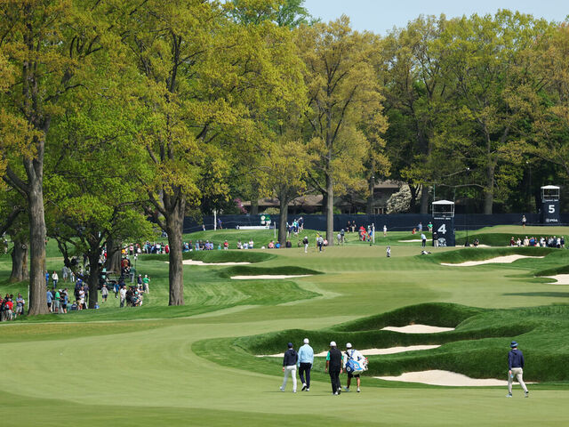 ROCHESTER, NEW YORK - MAY 15: A general view of the fourth hole as Rory McIlroy of Northern Ireland, Shane Lowry of Ireland and Luke Donald of England walk the fairway during a practice round prior to the 2023 PGA Championship at Oak Hill Country Club on May 15, 2023 in Rochester, New York.