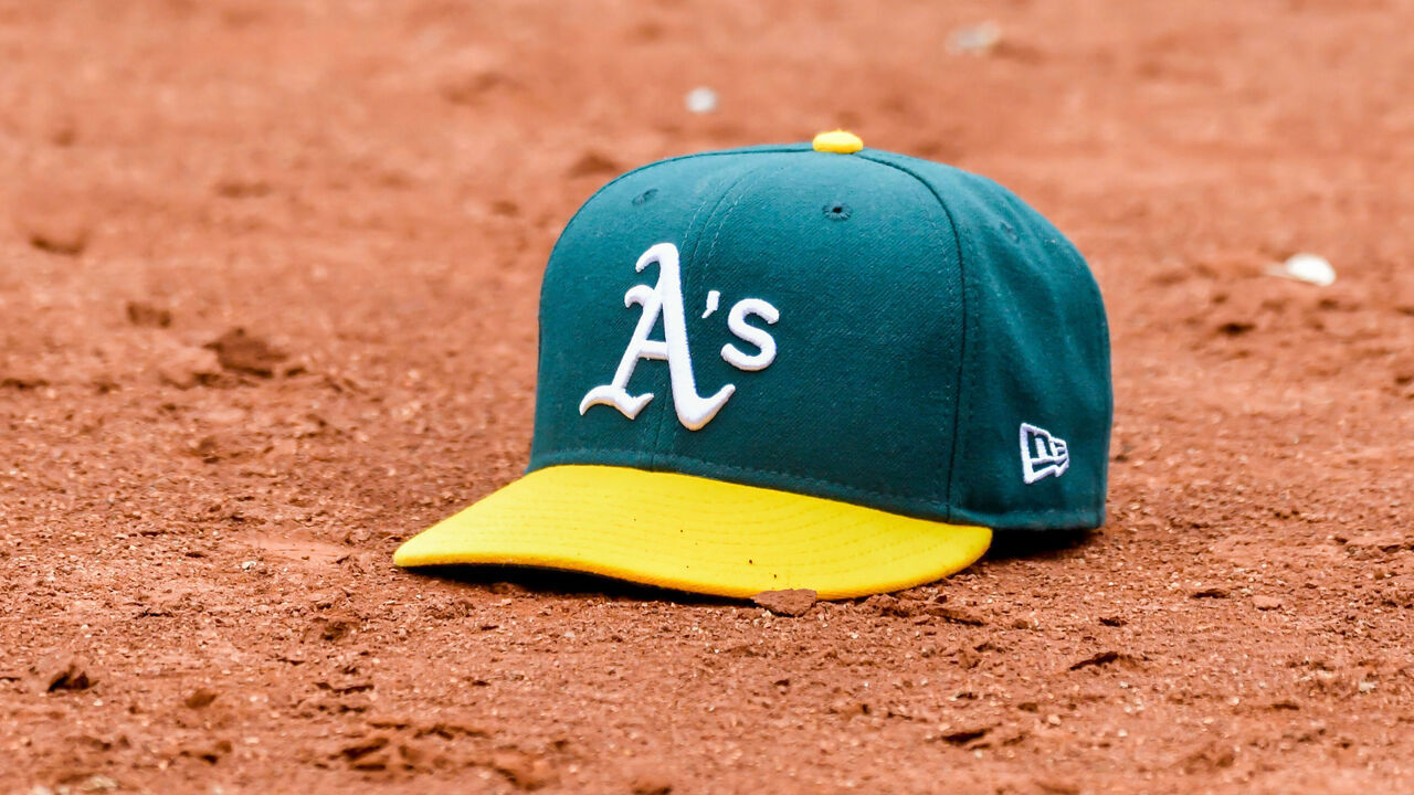 OAKLAND, CA - JULY 06: The A's dugout threw out a hat for Oakland Athletics second baseman Nick Allen (2) with his multiple field hat trick plays during the game between the Toronto Blue Jays and the Oakland Athletics on Wednesday, July 6, 2022 at the Oakland Coliseum in Oakland, California.