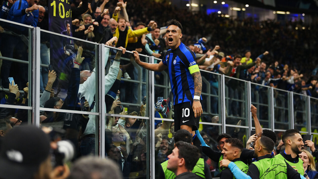MILAN, ITALY - MAY 16: Lautaro Martinez of FC Internazionale celebrates with fans after scoring the team's first goal during the UEFA Champions League semi-final second leg match between FC Internazionale and AC Milan at Stadio Giuseppe Meazza on May 16, 2023 in Milan, Italy.