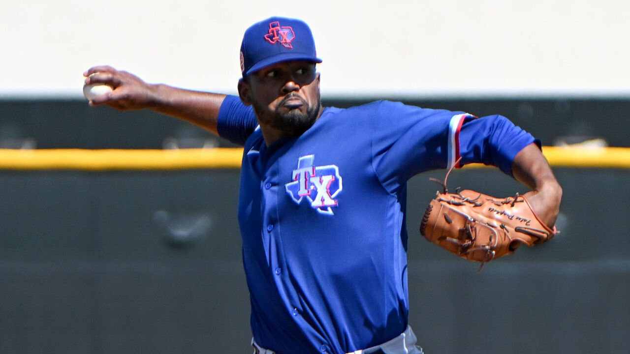SURPRISE, ARIZONA - MARCH 25, 2023: Kumar Rocker #80 of the Texas Rangers throws a pitch during a minor league spring training game against the Kansas City Royals at Surprise Stadium on March 25, 2023 in Surprise, Arizona.