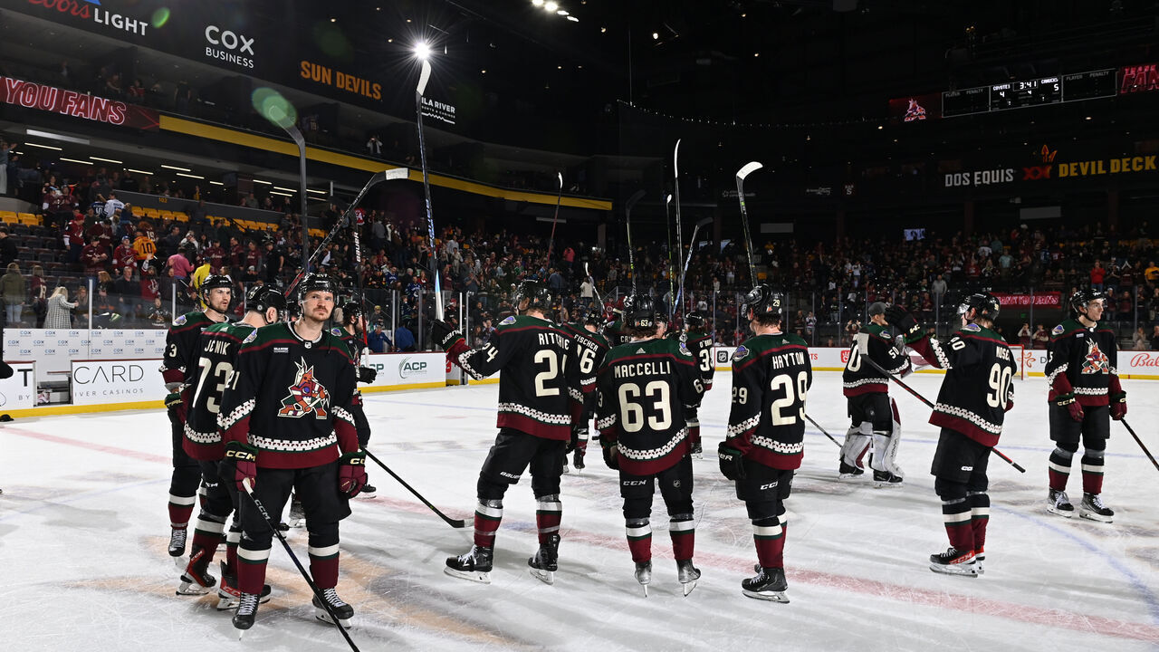 TEMPE, ARIZONA - APRIL 13: Players of the Arizona Coyotes salute the fans after a 5-4 overtime loss to the Vancouver Canucks in the final game of the season at Mullett Arena on April 13, 2023 in Tempe, Arizona.