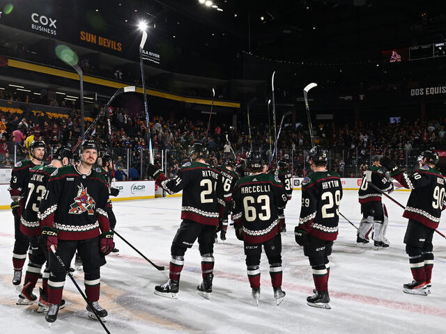 TEMPE, ARIZONA - APRIL 13: Players of the Arizona Coyotes salute the fans after a 5-4 overtime loss to the Vancouver Canucks in the final game of the season at Mullett Arena on April 13, 2023 in Tempe, Arizona.