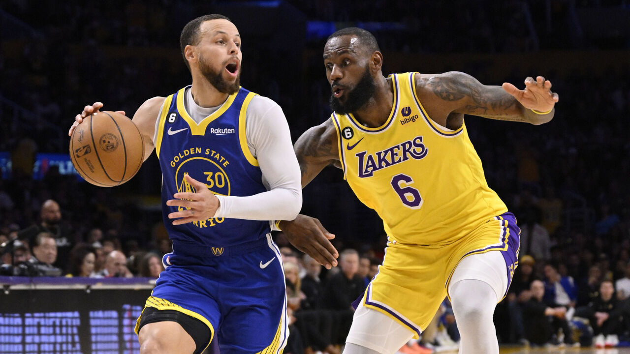 Los Angeles, CA - May 12: Stephen Curry #30 of the Golden State Warriors controls the ball against LeBron James #6 of the Los Angeles Lakers in the first half of game 6 of a Western Conference Semifinals NBA playoff basketball game at the Crypto.com Arena in Los Angeles on Friday, May 12, 2023.