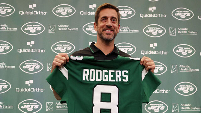 FLORHAM PARK, NEW JERSEY - APRIL 26: New York Jets quarterback Aaron Rodgers poses with a jersey during an introductory press conference at Atlantic Health Jets Training Center on April 26, 2023 in Florham Park, New Jersey.