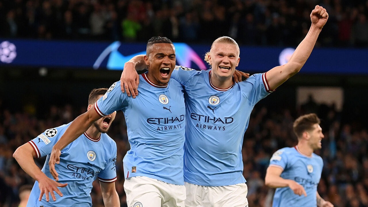MANCHESTER, ENGLAND - MAY 17: Manuel Akanji celebrates with Erling Haaland of Manchester City after an own goal by Eder Militao of Real Madrid (not pictured) Manchester City's third goal during the UEFA Champions League semi-final second leg match between Manchester City FC and Real Madrid at Etihad Stadium on May 17, 2023 in Manchester, England.