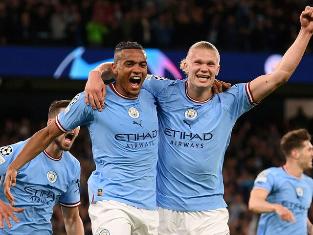 MANCHESTER, ENGLAND - MAY 17: Manuel Akanji celebrates with Erling Haaland of Manchester City after an own goal by Eder Militao of Real Madrid (not pictured) Manchester City's third goal during the UEFA Champions League semi-final second leg match between Manchester City FC and Real Madrid at Etihad Stadium on May 17, 2023 in Manchester, England.