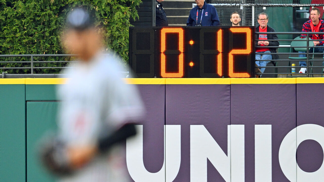 CLEVELAND, OHIO - MAY 05: The pitch clock looms behind starting pitcher Bailey Ober #17 of the Minnesota Twins during the first inning against the Cleveland Guardians at Progressive Field on May 05, 2023 in Cleveland, Ohio.