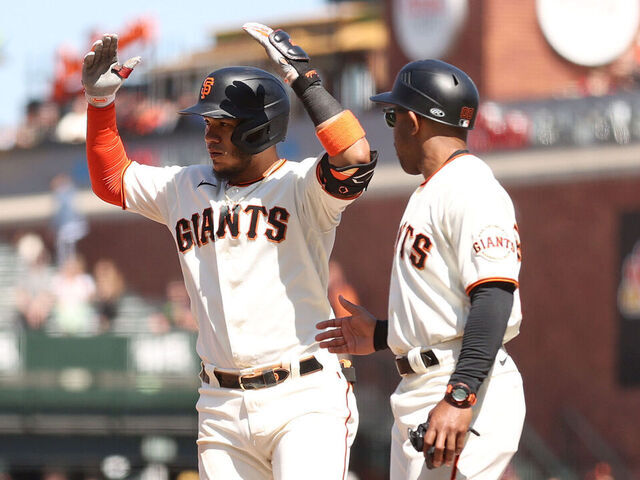 San Francisco Giants' Mitch Haniger scores on a single by Casey