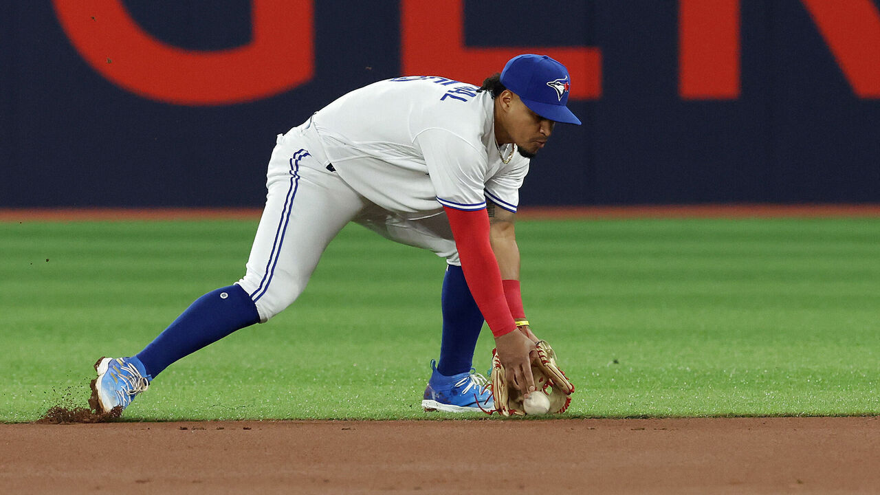 TORONTO, ON - MAY 17 - Toronto Blue Jays second baseman Santiago Espinal (5) fields a ground ball as the Toronto Blue Jays play the New York Yankees at Rogers Centre in Toronto. May 17, 2023. (Steve Russell/Toronto Star via Getty Images)