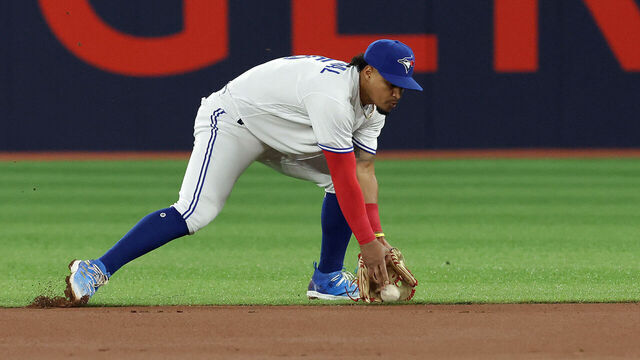 TORONTO, ON - MAY 17 - Toronto Blue Jays second baseman Santiago Espinal (5) fields a ground ball as the Toronto Blue Jays play the New York Yankees at Rogers Centre in Toronto. May 17, 2023. (Steve Russell/Toronto Star via Getty Images)
