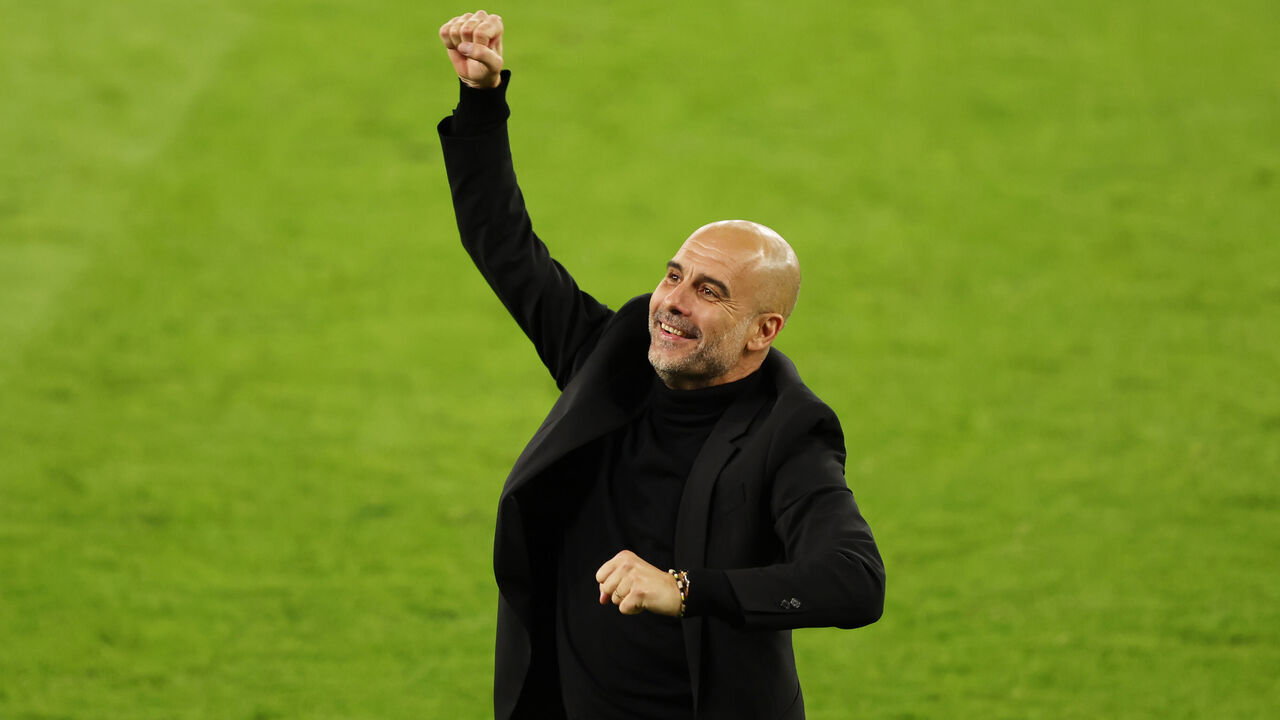 MANCHESTER, ENGLAND - MAY 17: Pep Guardiola, Manager of Manchester City celebrates after the teams fourth goal scored by Julian Alvarez (not pictured) during the UEFA Champions League semi-final second leg match between Manchester City FC and Real Madrid at Etihad Stadium on May 17, 2023 in Manchester, England.