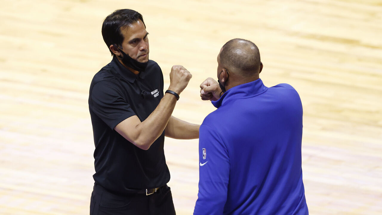 MIAMI, FLORIDA - MAY 13: Head coach Erik Spoelstra of the Miami Heat fist bumps head coach Doc Rivers after the game at American Airlines Arena on May 13, 2021 in Miami, Florida.