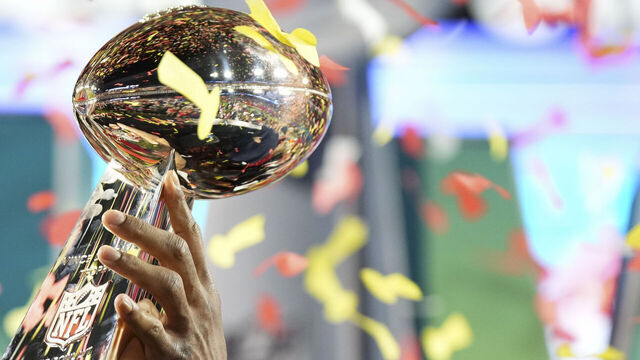 GLENDALE, AZ - FEBRUARY 12: A detailed view of confetti reflecting in the Lombardi trophy after Super Bowl LVII against the Philadelphia Eagles at State Farm Stadium on February 12, 2023 in Glendale, Arizona. The Chiefs defeated the Eagles 38-35.