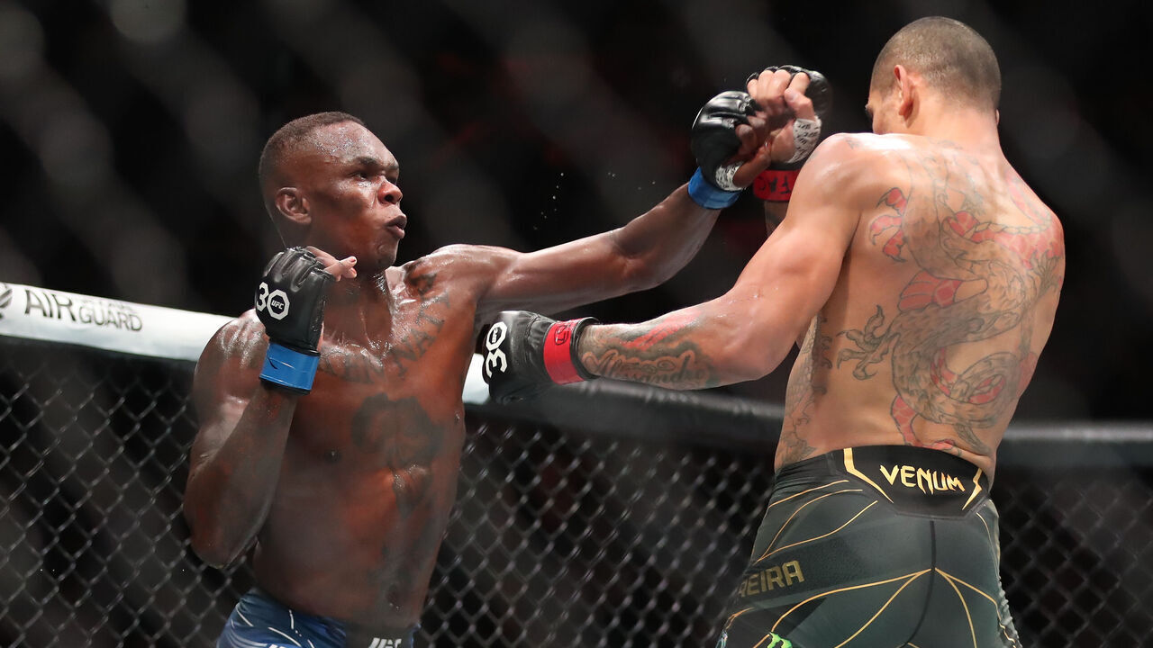 MIAMI, FLORIDA - APRIL 8: (L-R) Israel Adesanya punches Alex Pereira battles in their middleweight fight during the UFC 287 event on April 8, 2023, at the Kaseya Center in Miami, FL.