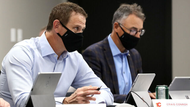 CALGARY, AB - OCTOBER 06: Assistant general manager Craig Conroy of the Calgary Flames looks on from the draft table during the first round of the 2020 NHL Entry Draft at the Scotiabank Saddledome on October 06, 2020 in Calgary, Alberta, Canada. The 2020 NHL Draft was held virtually due to the ongoing Coronavirus pandemic.