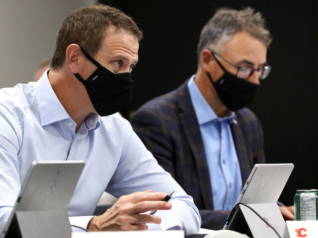 CALGARY, AB - OCTOBER 06: Assistant general manager Craig Conroy of the Calgary Flames looks on from the draft table during the first round of the 2020 NHL Entry Draft at the Scotiabank Saddledome on October 06, 2020 in Calgary, Alberta, Canada. The 2020 NHL Draft was held virtually due to the ongoing Coronavirus pandemic.