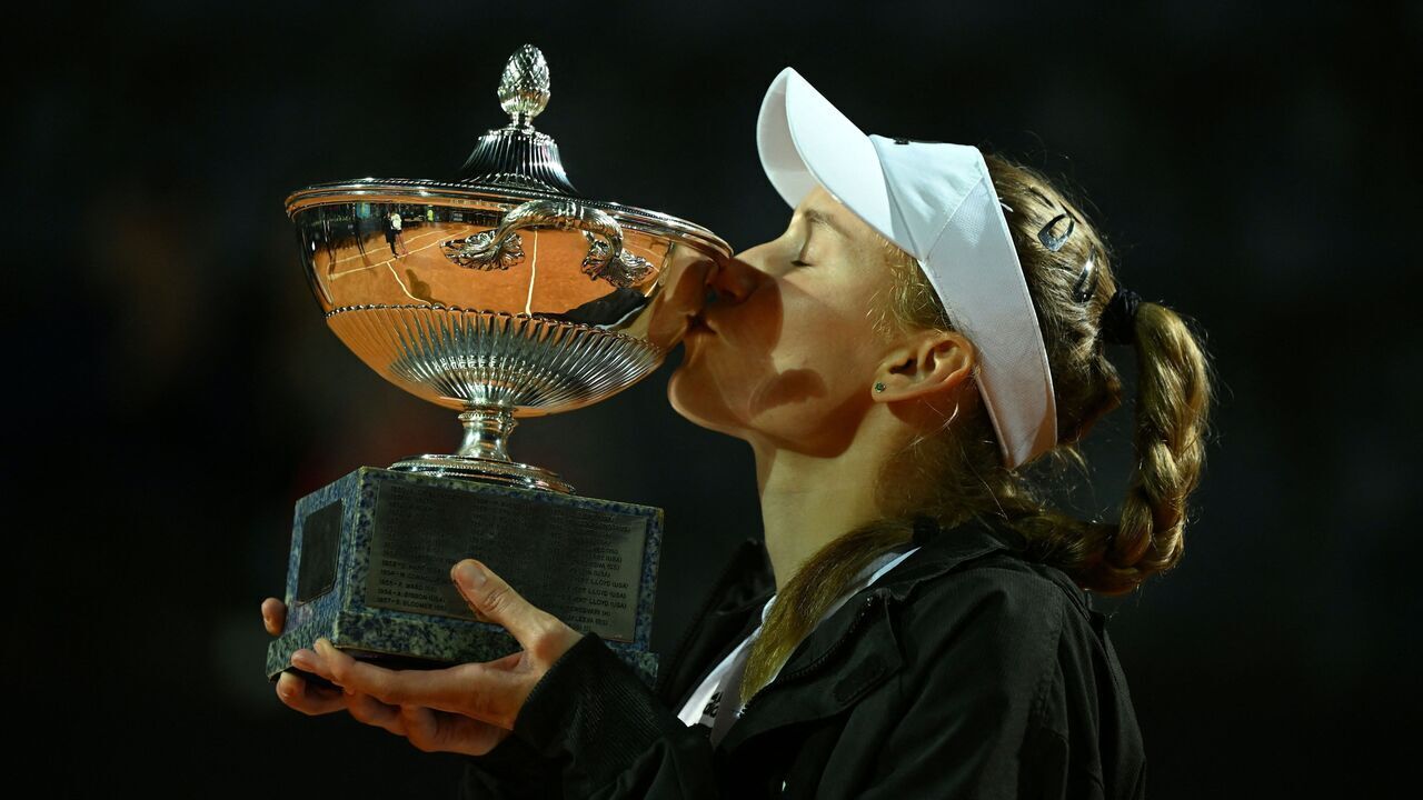 Kazakhstan's Elena Rybakina kisses her trophy celebrating winning the final match of the Women's WTA Rome Open tennis tournament against Ukraine's Anhelina Kalinina at Foro Italico in Rome on May 20, 2023. Rybakina wins the Rome WTA at the start of the second set of the finals after Kalinina forefeited due to an injury.