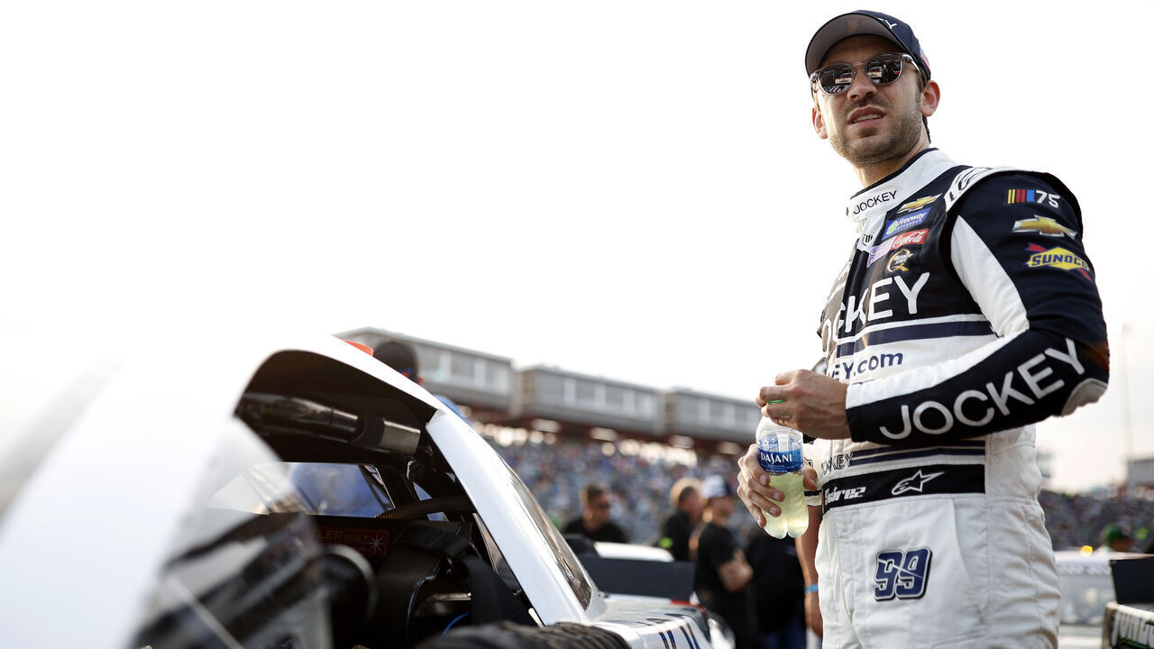 NORTH WILKESBORO, NORTH CAROLINA - MAY 17: Daniel Suarez, driver of the #99S Late Model Stock Car, stands on the grid prior to the CARS Late Model Stock Car Tour Window World 125 at North Wilkesboro Speedway on May 17, 2023 in North Wilkesboro, North Carolina.