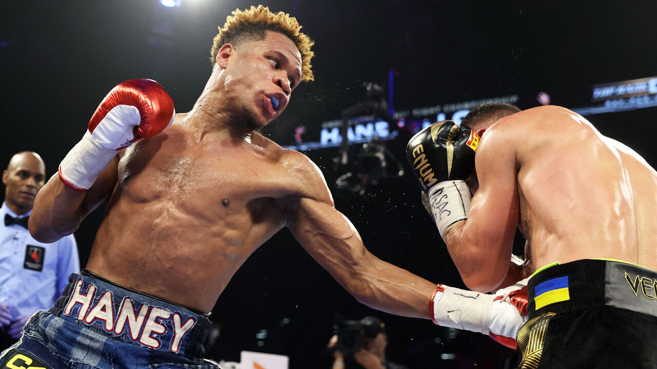 LAS VEGAS, NEVADA - MAY 20: Devin Haney (L) and Vasiliy Lomachenko (R) exchange punches during their Undisputed lightweight championship fight at MGM Grand Hotel & Casino on May 20, 2023 in Las Vegas, Nevada.