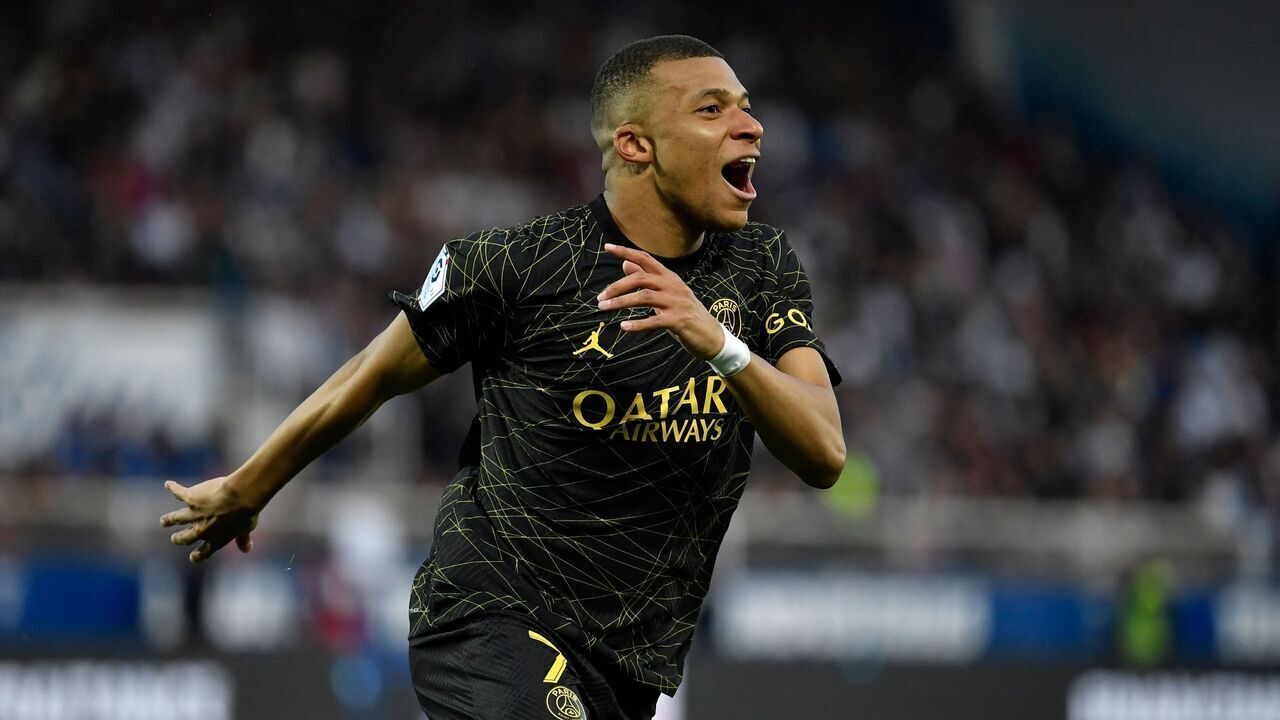 Paris Saint-Germain's French forward Kylian Mbappe celebrates after scoring a goal during the French L1 football match between AJ Auxerre and Paris Saint-Germain (PSG) at Stade de l'Abbe-Deschamps in Auxerre, central France, on May 21, 2023.