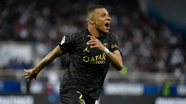 Paris Saint-Germain's French forward Kylian Mbappe celebrates after scoring a goal during the French L1 football match between AJ Auxerre and Paris Saint-Germain (PSG) at Stade de l'Abbe-Deschamps in Auxerre, central France, on May 21, 2023.