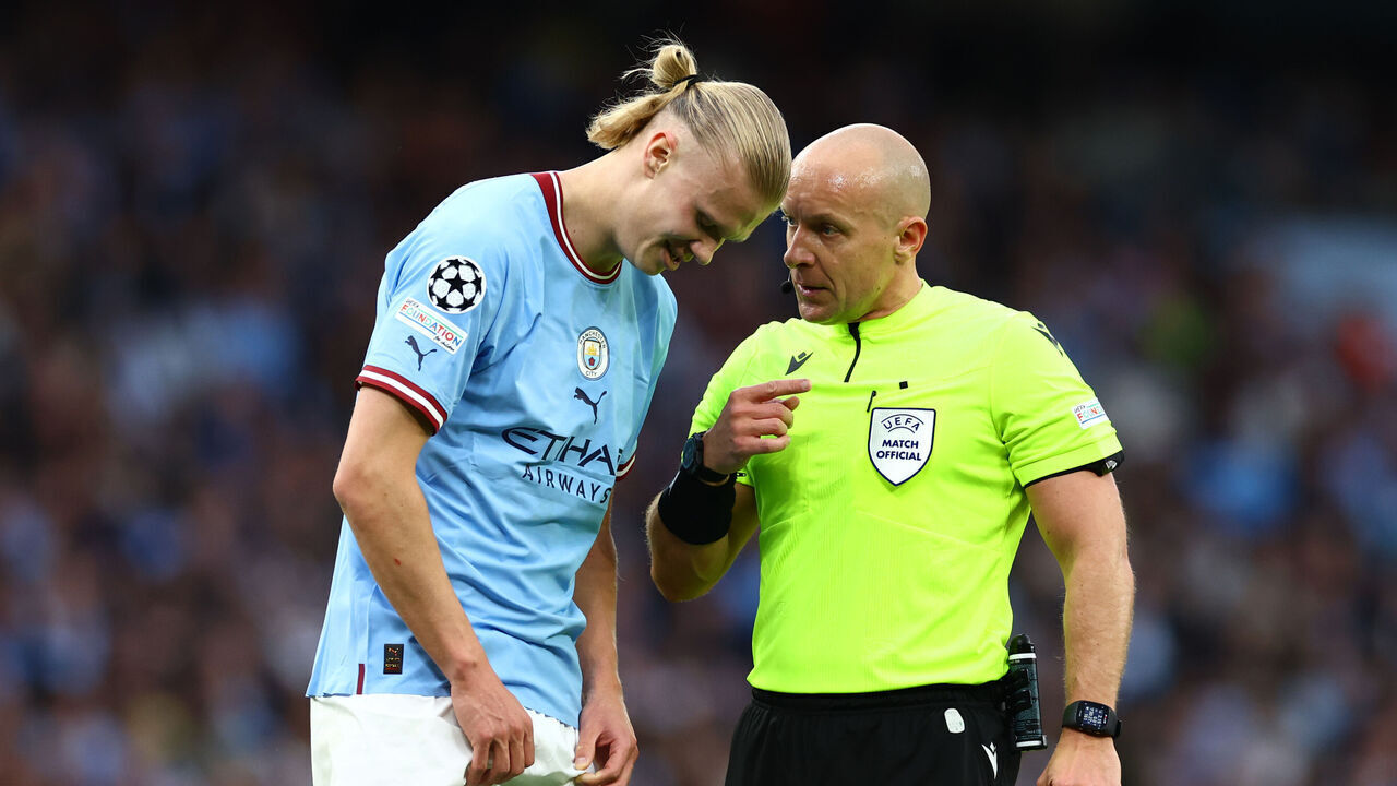 MANCHESTER, ENGLAND - MAY 17: Referee Szymon Marciniak speaks to Erling Haaland of Manchester City during the UEFA Champions League semi-final second leg match between Manchester City FC and Real Madrid at Etihad Stadium on May 17, 2023 in Manchester, United Kingdom.