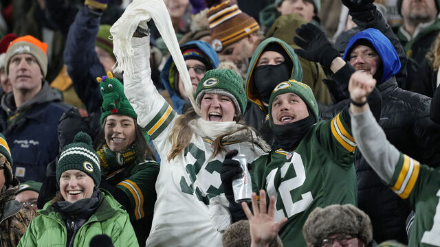 GREEN BAY, WISCONSIN - DECEMBER 19: Green Bay Packers fans cheer during the first half against the Los Angeles Rams at Lambeau Field on December 19, 2022 in Green Bay, Wisconsin.