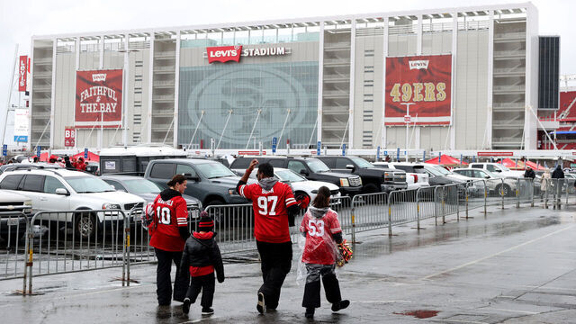 SANTA CLARA, CALIFORNIA - JANUARY 14: San Francisco 49ers fans walk in the parking lot prior to the NFC Wild Card playoff game between the Seattle Seahawks and the San Francisco 49ers at Levi's Stadium on January 14, 2023 in Santa Clara, California.