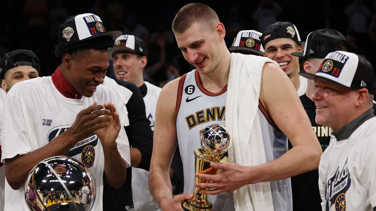 LOS ANGELES, CALIFORNIA - MAY 22: Nikola Jokic #15 of the Denver Nuggets celebrates with teammates after receiving the Most Valuable Player Trophy following game four of the Western Conference Finals against the Los Angeles Lakers at Crypto.com Arena on May 22, 2023 in Los Angeles, California.