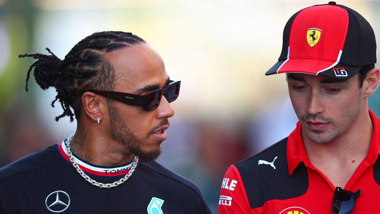 JEDDAH, SAUDI ARABIA - MARCH 16: Lewis Hamilton of Great Britain and Mercedes and Charles Leclerc of Monaco and Scuderia Ferrari looks on during previews ahead of the F1 Grand Prix of Saudi Arabia at Jeddah Corniche Circuit on March 16, 2023 in Jeddah, Saudi Arabia.