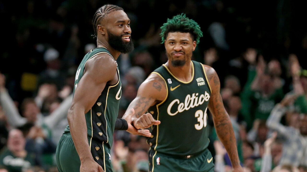 BOSTON, MA - November 23: Jaylen Brown #7 and Marcus Smart #36 of the Boston Celtics celebrate during the second half of the NBA game against the Dallas Mavericks at the TD Garden on November 23, 2022 in Boston, Massachusetts.