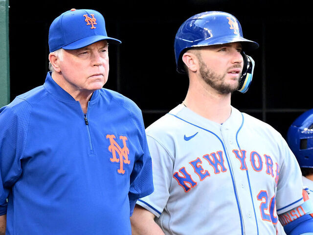 WASHINGTON, DC - AUGUST 02: Pete Alonso #20 and Manager Buck Showalter #11 of the New York Mets watches the game against the Washington Nationals at Nationals Park on August 02, 2022 in Washington, DC.