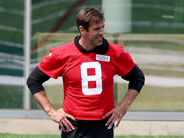 FLORHAM PARK, NEW JERSEY - MAY 23: Aaron Rodgers #8 of the New York Jets stretches during an offseason workout session at Atlantic Health Jets Training Center on May 23, 2023 in Florham Park, New Jersey.