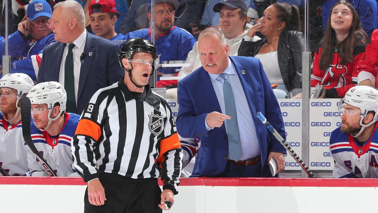 NEWARK, NJ - MAY 01: Gerard Gallant head coach of the New York Rangers talks with referee Gord Dwyer #19 during Game Seven of the First Round of the 2023 Stanley Cup Playoffs against the New Jersey Devils at the Prudential Center on May 1, 2023 in Newark, New Jersey.
