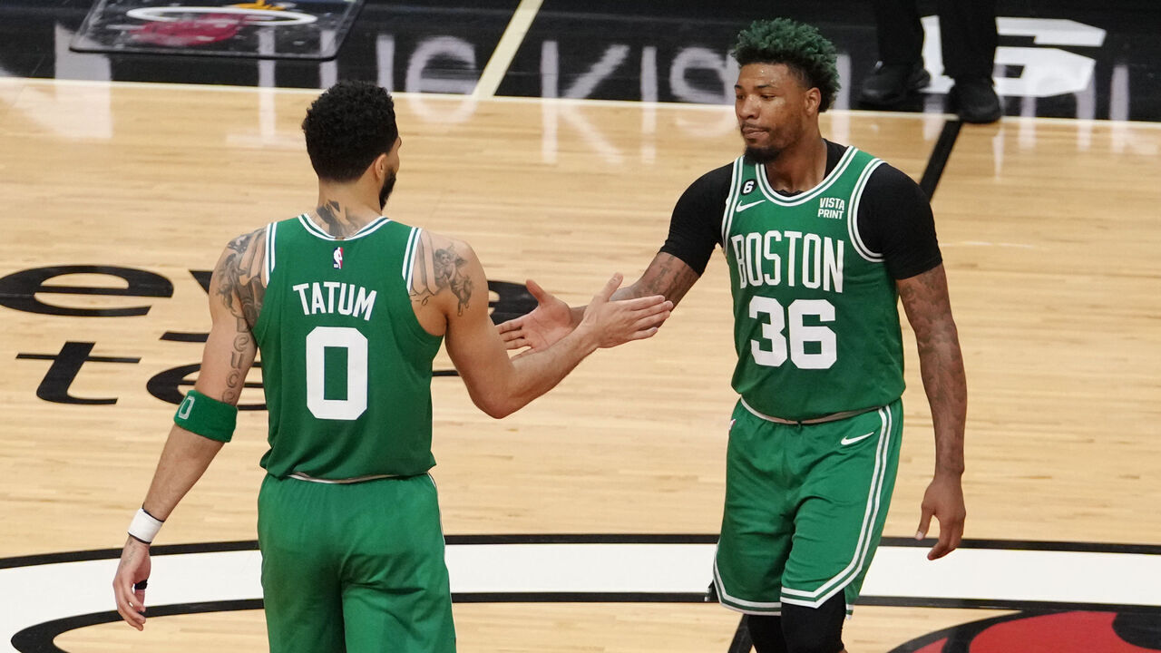 MIAMI, FL - MAY 23: Jayson Tatum #0 high fives Marcus Smart #36 of the Boston Celtics during round 3 game 4 of the Eastern Conference finals 2023 NBA Playoffs against the Miami Heat on May 23, 2023 at Kaseya Center in Miami, Florida. Mandatory Copyright Notice: Copyright 2023 NBAE