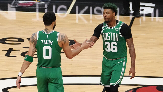 MIAMI, FL - MAY 23: Jayson Tatum #0 high fives Marcus Smart #36 of the Boston Celtics during round 3 game 4 of the Eastern Conference finals 2023 NBA Playoffs against the Miami Heat on May 23, 2023 at Kaseya Center in Miami, Florida. Mandatory Copyright Notice: Copyright 2023 NBAE