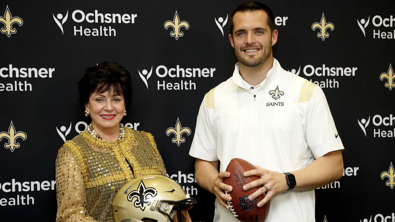 NEW ORLEANS, LOUISIANA - MARCH 11: Gayle Benson, owner of the New Orleans Saints poses with Quarterback Derek Carr of the New Orleans Saints after signing a four-year contract with the Saints at New Orleans Saints Indoor Practice Facility on March 11, 2023 in New Orleans, Louisiana.
