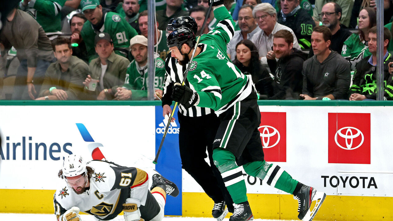 DALLAS, TEXAS - MAY 23: Jamie Benn #14 of the Dallas Stars is called for a 5-minute major and a game misconduct for a cross-checking penalty against Mark Stone #61 of the Vegas Golden Knights during the first period in Game Three of the Western Conference Final of the 2023 Stanley Cup Playoffs at American Airlines Center on May 23, 2023 in Dallas, Texas.